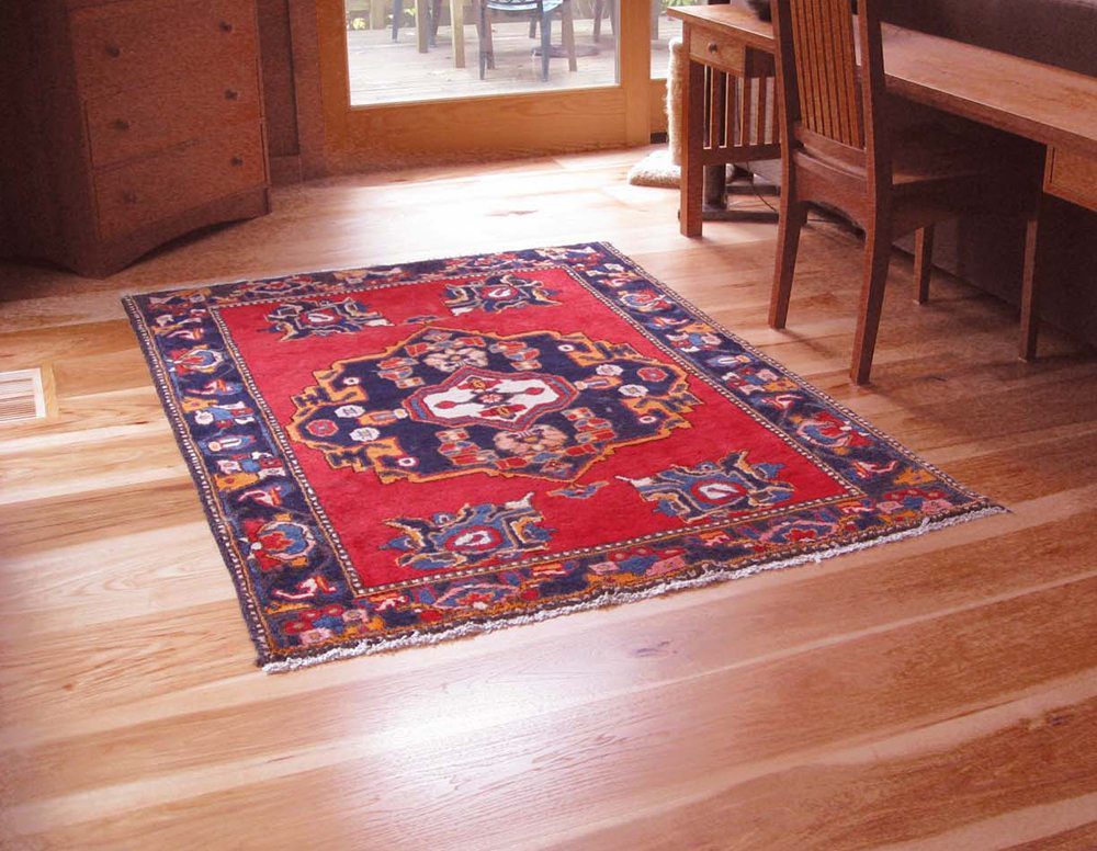 a beautiful office space with hardwood flooring