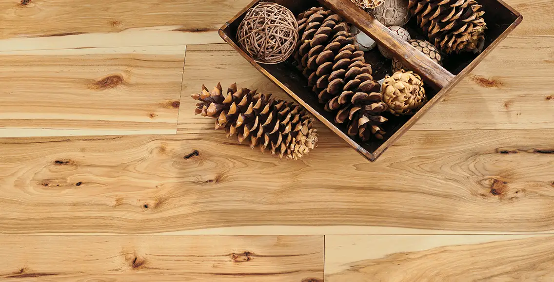 natural Hickory flooring with rustic pine cone accents.