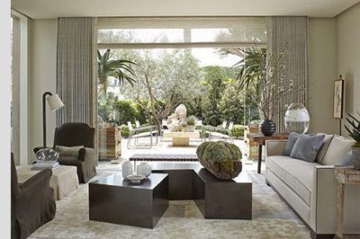 A modern contemporary living room with window wall