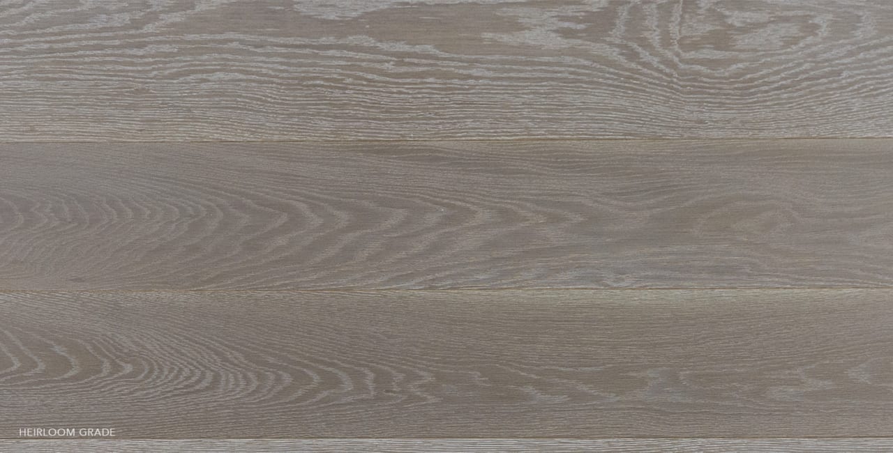 Gray wide plank wood surface with subtle horizontal grain, natural wear.