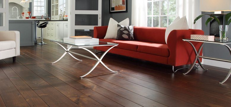 prefinished wood floor under red couch