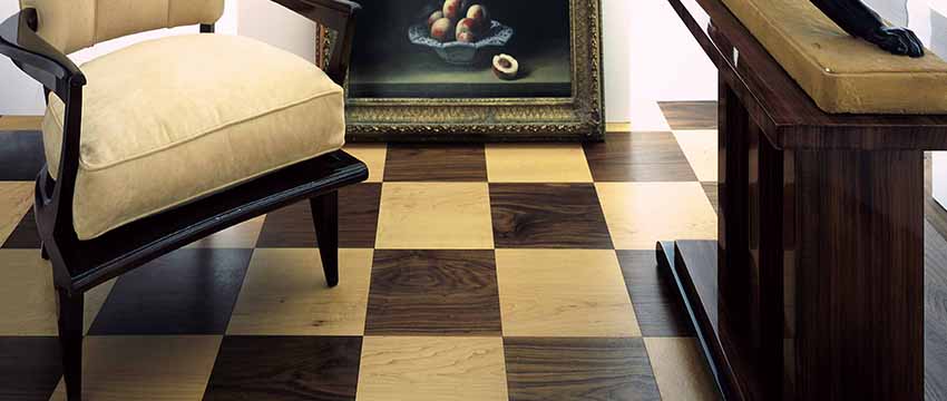 Dark and light hardwood flooring in a checkerboard pattern