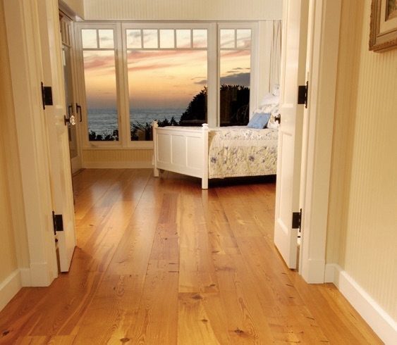 Heart pine flooring in oceanfront bedroom