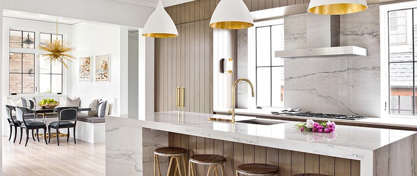 A clean white kitchen accented with Carlisle wide plank floors