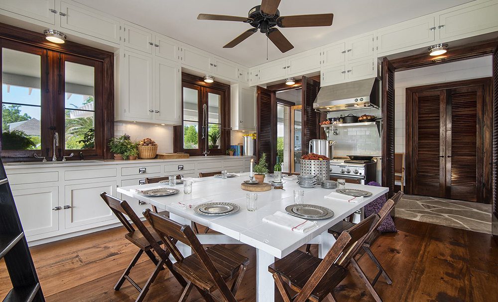A home kitchen with dark wood with white accents