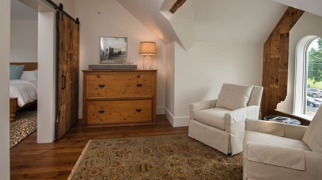 An upstairs bedroom with Carlisle Wide Plank flooring