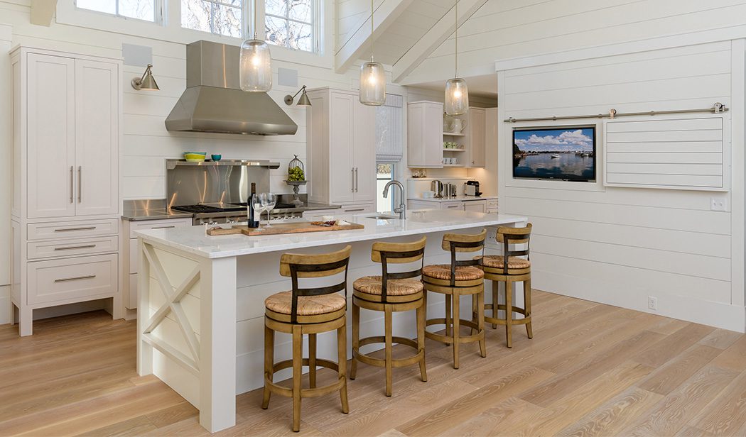 Modern farmhouse kitchen featuring White Oak hardwood flooring from Carlisle