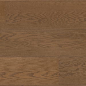 Light brown wide plank flooring with faint natural wood grain, creating a seamless surface.