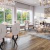 Elegant living-dining room on wide plank floor with chandelier.
