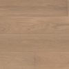 Light brown wide plank flooring with a natural grain pattern, filling the entire frame.