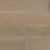 Smooth light brown wide plank flooring with horizontal grain.