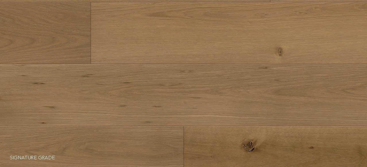 Natural light brown wide plank floors with grain and occasional knots.