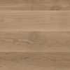 Close-up of wooden surface with natural grain on wide plank flooring, shades of light brown, rustic ambiance.