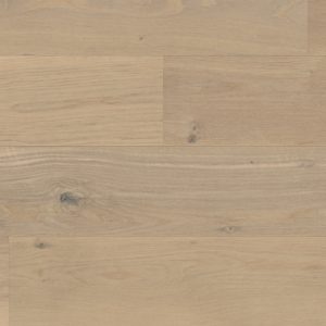 Light wooden wide plank flooring with subtle grain, creating a calming, natural look.